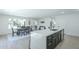 Open concept kitchen with an island and the dining room visible in the background at 47 Spur Cir, Scottsdale, AZ 85251
