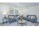 Comfortable living room with cozy sofas, a glass coffee table, and tasteful decor at 47 Spur Cir, Scottsdale, AZ 85251