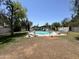 Community pool with well-manicured grass, lounge chairs and tables, perfect for Gathering time at 47 Spur Cir, Scottsdale, AZ 85251
