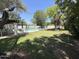 Community pool surrounded by lush greenery, lounge chairs and tables, perfect for relaxing at 47 Spur Cir, Scottsdale, AZ 85251