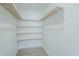 A well-organized walk-in closet with multiple shelves for ample storage at 47 Spur Cir, Scottsdale, AZ 85251