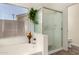 A primary bathroom featuring a bathtub and standing shower with glass doors at 623 W Harvard Ave, Gilbert, AZ 85233