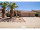 Beautiful single-story home with desert landscaping, tile roof, and a spacious three-car garage at 623 W Harvard Ave, Gilbert, AZ 85233
