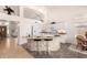 Bright kitchen featuring white cabinets, stone countertops, and a center island with seating at 623 W Harvard Ave, Gilbert, AZ 85233