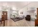 Bright living room with vaulted ceilings, hardwood floors, and neutral tones at 623 W Harvard Ave, Gilbert, AZ 85233