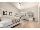 Bright main bedroom with wood floors, ceiling fan, backyard views, and a glass sliding door at 623 W Harvard Ave, Gilbert, AZ 85233