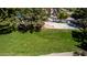 Shaded park with mature trees, a basketball court, and walking paths at 623 W Harvard Ave, Gilbert, AZ 85233
