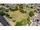 Aerial view of the green space with a playground and adjacent neighborhood at 623 W Harvard Ave, Gilbert, AZ 85233