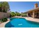 A refreshing swimming pool is surrounded by lush landscaping, creating a private retreat at 623 W Harvard Ave, Gilbert, AZ 85233