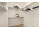 Walk-in closet featuring built-in shelving at 623 W Harvard Ave, Gilbert, AZ 85233