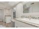 Bright bathroom featuring dual sinks, granite countertops, and a tiled shower at 635 N Yale Dr, Gilbert, AZ 85234