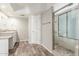 Bathroom with granite countertops, and tiled shower stall with glass door at 635 N Yale Dr, Gilbert, AZ 85234