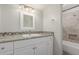 Updated bathroom featuring a granite vanity top and tiled shower at 635 N Yale Dr, Gilbert, AZ 85234