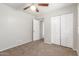 A neutral bedroom featuring carpet and a closet at 635 N Yale Dr, Gilbert, AZ 85234