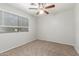 Neutral bedroom featuring carpet, mini blinds and a ceiling fan at 635 N Yale Dr, Gilbert, AZ 85234