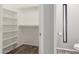 Walk-in closet with built-in shelving and nearby toilet at 635 N Yale Dr, Gilbert, AZ 85234