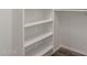 Walk-in closet with built-in shelving and wood-look floors at 635 N Yale Dr, Gilbert, AZ 85234