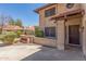 Home's stuccoed front entrance includes a terracotta roof and decorative brickwork at 635 N Yale Dr, Gilbert, AZ 85234