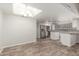 Open layout kitchen with stainless appliances, granite countertops, and overhead lighting at 635 N Yale Dr, Gilbert, AZ 85234