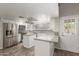 Bright kitchen with stainless appliances, granite countertops, and a tile backsplash at 635 N Yale Dr, Gilbert, AZ 85234