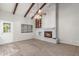Living room featuring a whitewashed brick fireplace and views to the front entrance at 635 N Yale Dr, Gilbert, AZ 85234