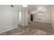 Open-concept living room featuring wood tile floors, neutral walls, and view to entry at 635 N Yale Dr, Gilbert, AZ 85234