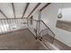 Cozy staircase area with carpet, a fireplace, and natural light from a window at 635 N Yale Dr, Gilbert, AZ 85234