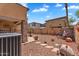 Desert landscaped backyard with a covered patio, rock features and creative decor at 6469 W Ruth Ave, Glendale, AZ 85302