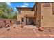Charming backyard featuring desert landscaping, brick accents, and an inviting patio at 6469 W Ruth Ave, Glendale, AZ 85302