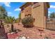 Lush backyard featuring desert landscaping and a blooming bougainvillea bush at 6469 W Ruth Ave, Glendale, AZ 85302