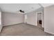 Spacious bedroom with carpet floors, neutral paint, ceiling fan, and ample natural light at 6469 W Ruth Ave, Glendale, AZ 85302
