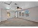 Bright bedroom featuring carpet floors, ceiling fan, natural light and multiple closets at 6469 W Ruth Ave, Glendale, AZ 85302