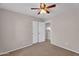 Carpeted bedroom features a ceiling fan, closet and neutral-color walls creating a comfortable and peaceful retreat at 6469 W Ruth Ave, Glendale, AZ 85302
