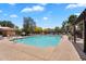 Sparkling community pool with lounge seating, perfect for relaxation and enjoying the sunny weather at 6469 W Ruth Ave, Glendale, AZ 85302