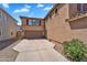 Side view of house featuring a two car garage and spacious driveway at 6469 W Ruth Ave, Glendale, AZ 85302