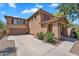Two story home with red shutter and arched entry way at 6469 W Ruth Ave, Glendale, AZ 85302