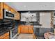 Kitchen featuring stainless steel appliances and light colored wood cabinets at 6469 W Ruth Ave, Glendale, AZ 85302