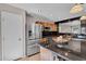 Kitchen featuring a stainless steel refrigerator and granite countertops at 6469 W Ruth Ave, Glendale, AZ 85302