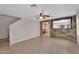 Living room featuring tile floors, stone accents, and an open floor plan at 6469 W Ruth Ave, Glendale, AZ 85302
