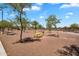Bright park with picnic tables and walking path at 6469 W Ruth Ave, Glendale, AZ 85302