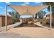 Community playground with a covered play structure, slide, and swings, perfect for outdoor activities at 6469 W Ruth Ave, Glendale, AZ 85302