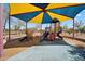 Shaded playground with multiple slides and climbing structures at 6469 W Ruth Ave, Glendale, AZ 85302
