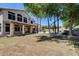 Beautiful backyard with covered patio, mature landscaping, pool, and custom BBQ at 7217 S Hazelton Ln, Tempe, AZ 85283