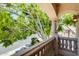 Balcony view of a lush tree and charming neighborhood street at 7217 S Hazelton Ln, Tempe, AZ 85283