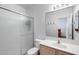 Bathroom featuring a frosted glass shower door, a light wood vanity, and a large mirror at 7217 S Hazelton Ln, Tempe, AZ 85283