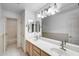 A bright bathroom with double sinks and a view of the bathtub/shower at 7217 S Hazelton Ln, Tempe, AZ 85283