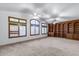 Spacious bedroom with custom built-in bookshelves and bright, natural light at 7217 S Hazelton Ln, Tempe, AZ 85283