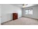 Bedroom with neutral carpet, a ceiling fan, and a window providing natural light at 7217 S Hazelton Ln, Tempe, AZ 85283