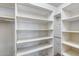 An organized walk-in closet featuring shelves for ample storage space at 7217 S Hazelton Ln, Tempe, AZ 85283