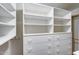 A walk-in closet featuring storage shelves and drawers for organization at 7217 S Hazelton Ln, Tempe, AZ 85283